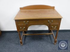 An Edwardian dressing table fitted with three drawers