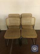 A set of four kitchen chairs on tubular metal legs