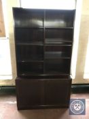 A set of Danish mahogany bookshelves with cupboard beneath