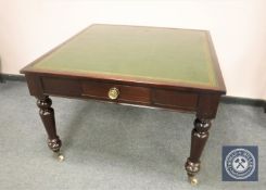A Victorian mahogany library table with tooled green leather top, 104 cm x 107 cm.
