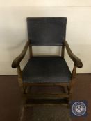 A twentieth century oak armchair upholstered in blue fabric
