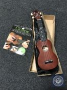 A Stagg ukulele with carry bag in box and a beginners hand book