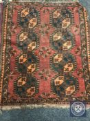 A fringed Afghan Bokhara rug,