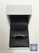 An 18ct white gold sapphire and diamond eternity ring CONDITION REPORT: Size V.