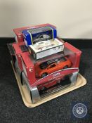 A tray of eight boxed die cast vehicles, Burago,