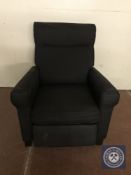 A contemporary armchair in black fabric