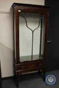 An early 20th century mahogany display cabinet, fitted with a drawer,