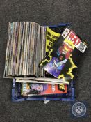 Approximately 100 Marvel and DC comics