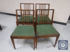 A set of four mid twentieth century rail backed kitchen chairs