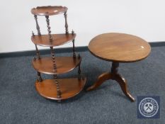 An oval mahogany pedestal occasional table together with a mahogany D-shaped four tier what-not