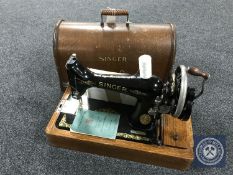 An oak cased vintage hand Singer sewing machine