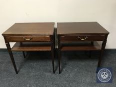 A pair of reproduction mahogany lamp tables fitted drawers
