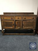 An early 20th century carved oak sideboard