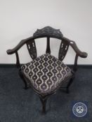 A Victorian mahogany corner armchair