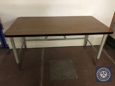 A mid 20th century office table on metal legs