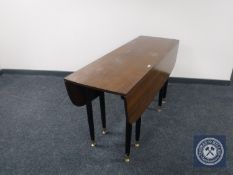 A late 20th century drop leaf table