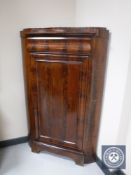 A late nineteenth century mahogany corner cabinet