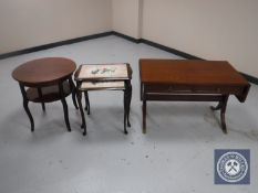 A mahogany flap sided sofa coffee table fitted with two drawers together with a circular mahogany