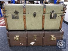Two vintage wooden bound shipping trunks containing bedding and blankets