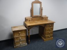 A pine dressing table together with three drawer bedside chest