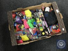 A box of loom bands and a quantity of cap gun re-fills