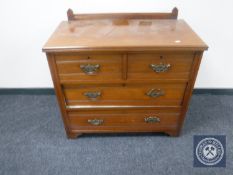 An Edwardian mahogany four drawer chest