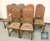 A set of ten late 19th century oak and tooled leather dining chairs.