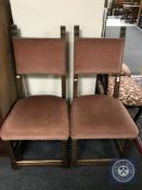 A pair of oak high backed dining chairs upholstered in pink dralon