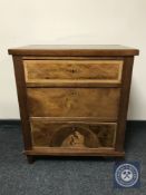 A 19th century continental inlaid mahogany three drawer chest