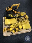 A tray of assorted plastic and die cast vehicles including JCB farming equipment, Hercules crane,