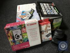 A tray of Panasonic NV MX 7D digital video camera, Canon card photo printer,