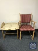 A blonde oak carver armchair together with a blonde oak butler's tray on stand