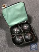 A Welkin bag containing four Taylor Elite lawn balls