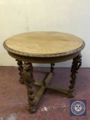 A circular oak centre table