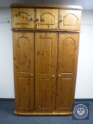 A pine triple door wardrobe