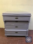 An antique oak painted four drawer chest
