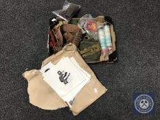 A box of military clothing, ammunition belt, brass button polisher, hand flares,
