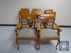 A set of eight continental mahogany dining chairs comprising of two carvers and six singles