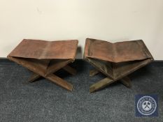A pair of African style leather topped stools