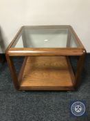 A teak G-plan glass topped coffee table
