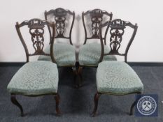A set of four late Victorian mahogany dining chairs of cabriole legs