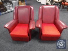 A pair of mid 20th century red vinyl armchairs