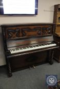 An early 20th century oak upright piano by James Smith & Son of Liverpool, width 146 cm.