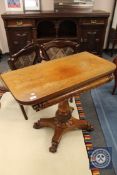 A 19th century mahogany tea table on pedestal base,
