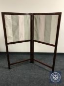 An Edwardian mahogany fire screen
