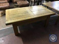 A pine farmhouse coffee table fitted with a drawer