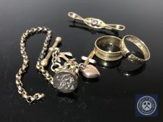 A 9ct gold amethyst and seed pearl brooch, a George III 18ct gold band ring dated 1818,