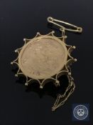 A 1912 half sovereign mounted in a brooch setting stamped 9ct, 6.