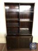 A mahogany open bookcase fitted with double cupboard beneath