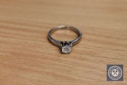 An 18ct white gold solitaire diamond ring